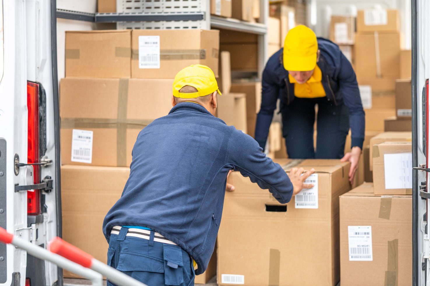 Delivery person loading boxes